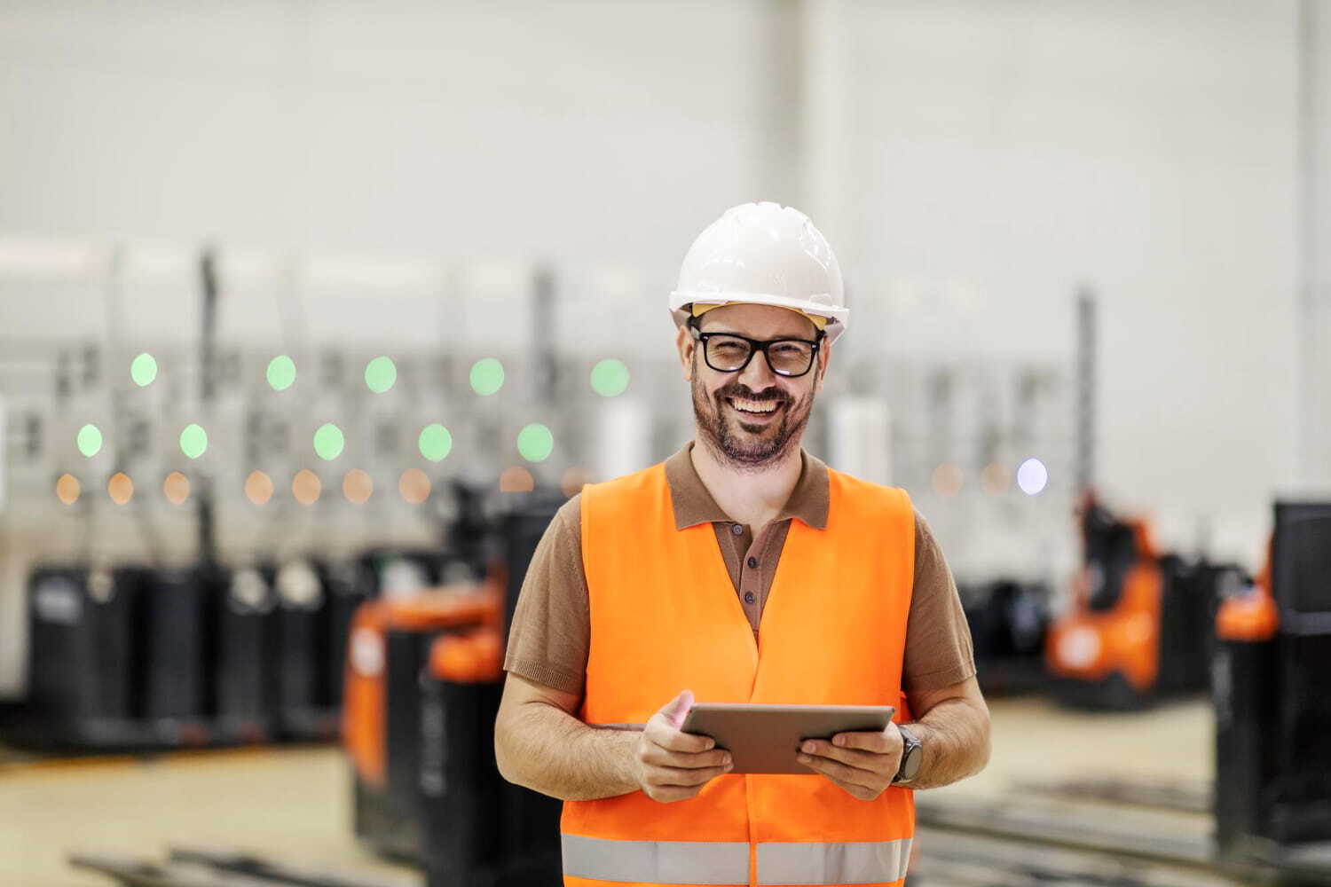 Operator with a tablet on the factory floor