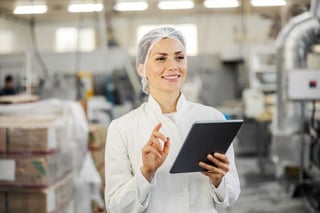 Operator with a tablet in a food factory