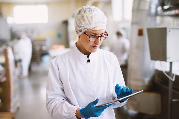 Operator checking the line on a tablet